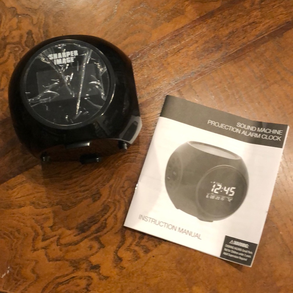 Sharper image projection alarm clock sound machine